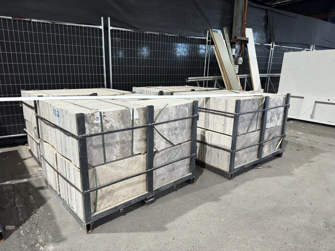 Crated stone stacked on the floor of a warehouse